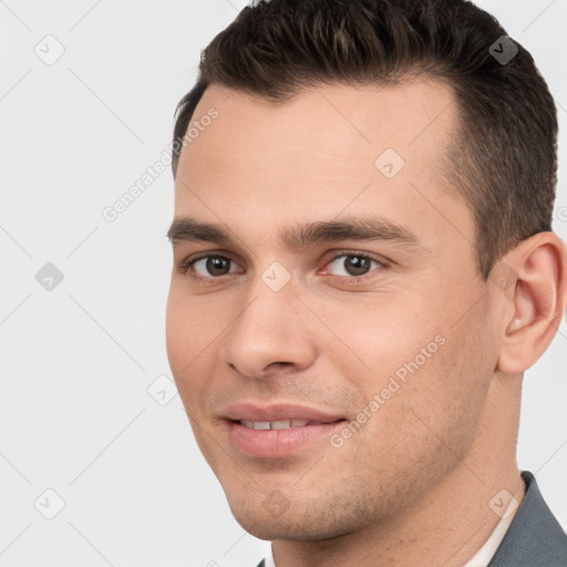 Joyful white young-adult male with short  brown hair and brown eyes