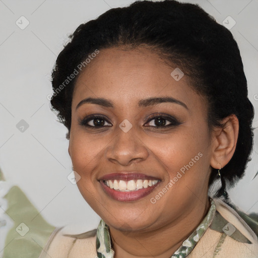 Joyful black young-adult female with short  brown hair and brown eyes