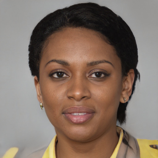 Joyful latino young-adult female with short  black hair and brown eyes