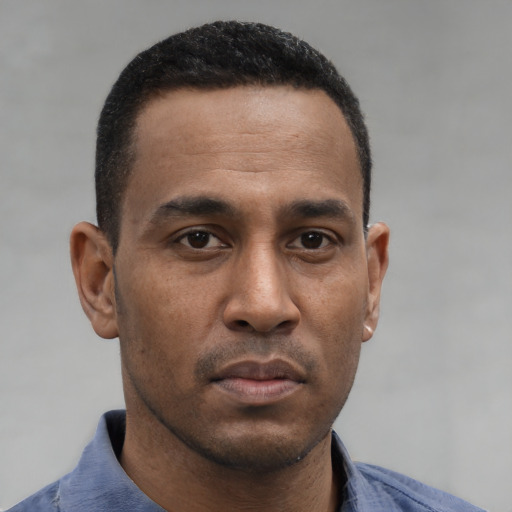 Neutral black young-adult male with short  brown hair and brown eyes