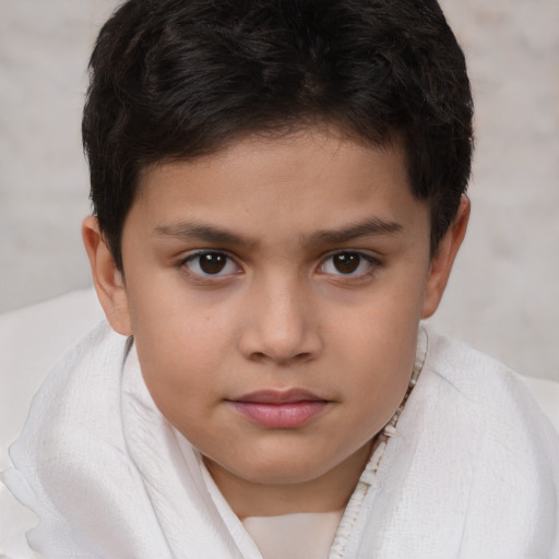 Joyful white child female with short  brown hair and brown eyes