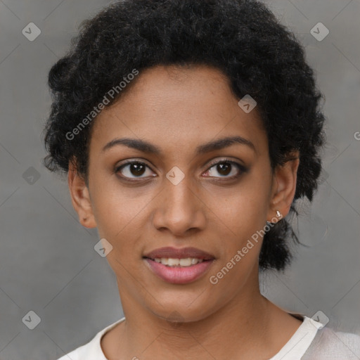 Joyful black young-adult female with short  black hair and brown eyes