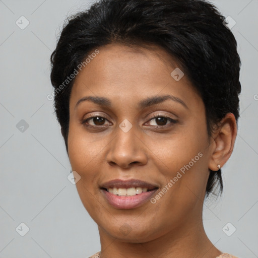 Joyful latino young-adult female with short  brown hair and brown eyes