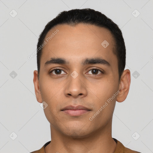 Neutral latino young-adult male with short  black hair and brown eyes