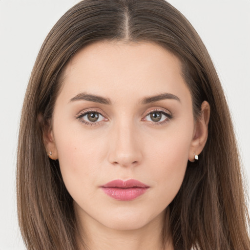 Neutral white young-adult female with long  brown hair and brown eyes