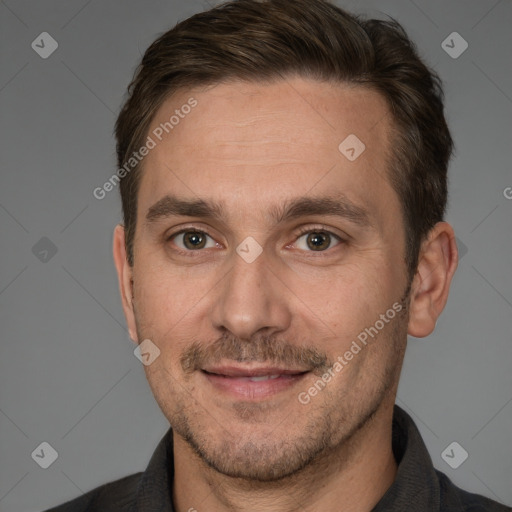 Joyful white adult male with short  brown hair and brown eyes