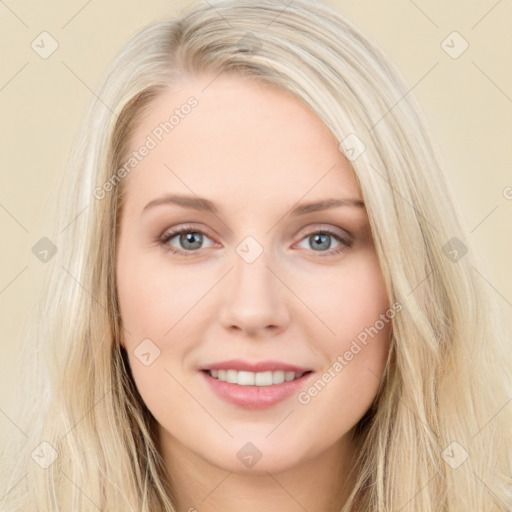 Joyful white young-adult female with long  brown hair and blue eyes