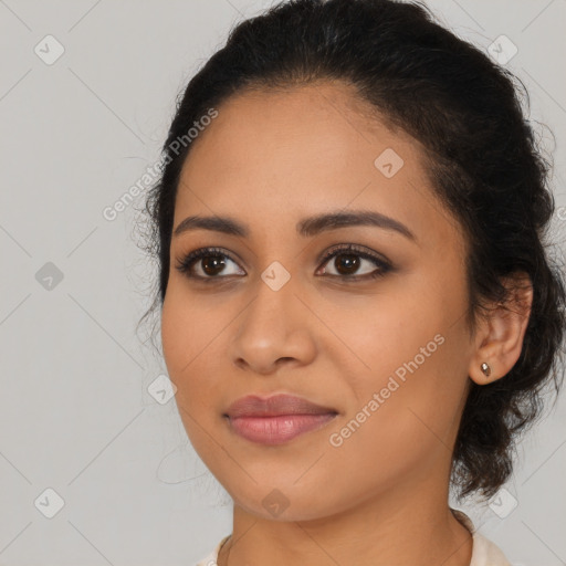 Joyful latino young-adult female with long  brown hair and brown eyes