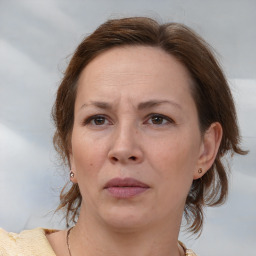 Joyful white adult female with medium  brown hair and brown eyes