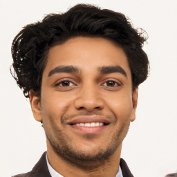 Joyful latino young-adult male with short  brown hair and brown eyes