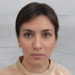 Neutral white young-adult female with short  brown hair and brown eyes