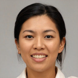 Joyful asian young-adult female with medium  brown hair and brown eyes