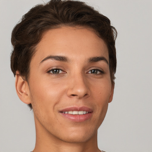 Joyful white young-adult female with short  brown hair and brown eyes