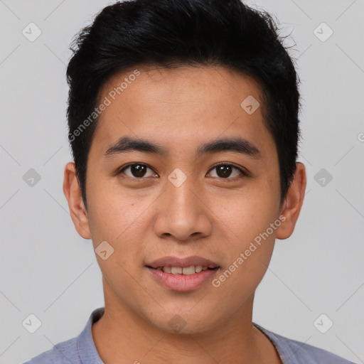 Joyful asian young-adult male with short  black hair and brown eyes