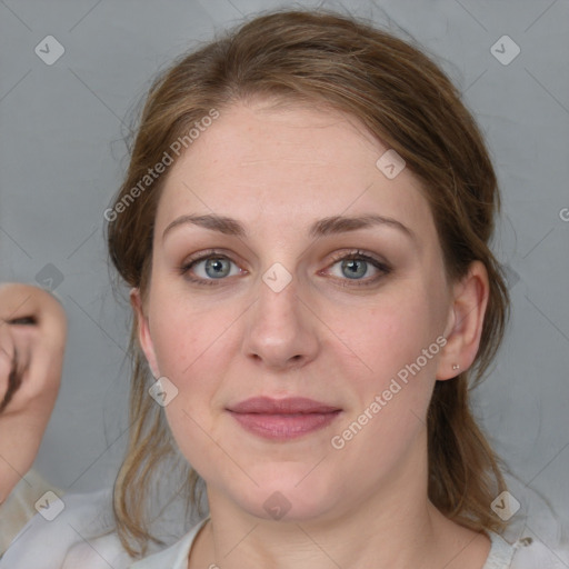 Joyful white young-adult female with medium  brown hair and blue eyes