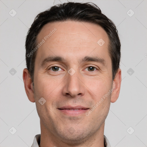 Joyful white adult male with short  brown hair and brown eyes