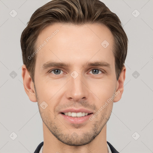 Joyful white young-adult male with short  brown hair and grey eyes