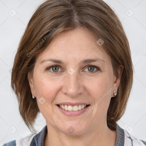 Joyful white adult female with medium  brown hair and grey eyes