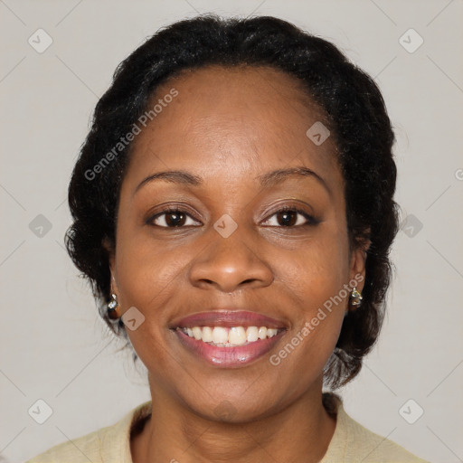 Joyful black adult female with medium  brown hair and brown eyes