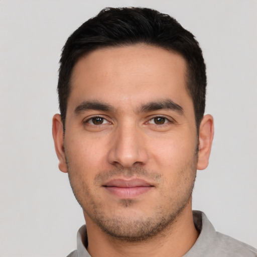 Neutral white young-adult male with short  black hair and brown eyes