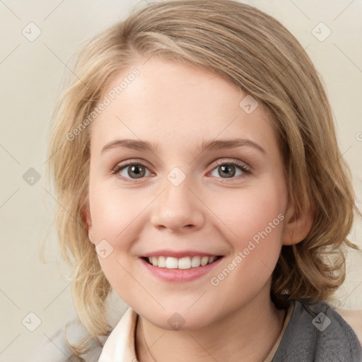 Joyful white young-adult female with medium  brown hair and blue eyes