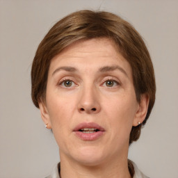 Joyful white adult female with short  brown hair and grey eyes