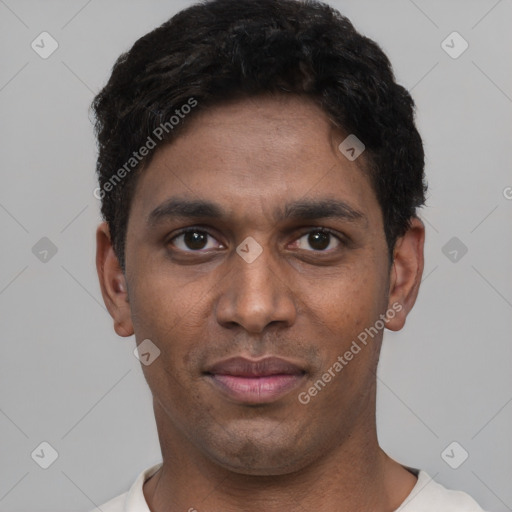 Joyful black young-adult male with short  black hair and brown eyes