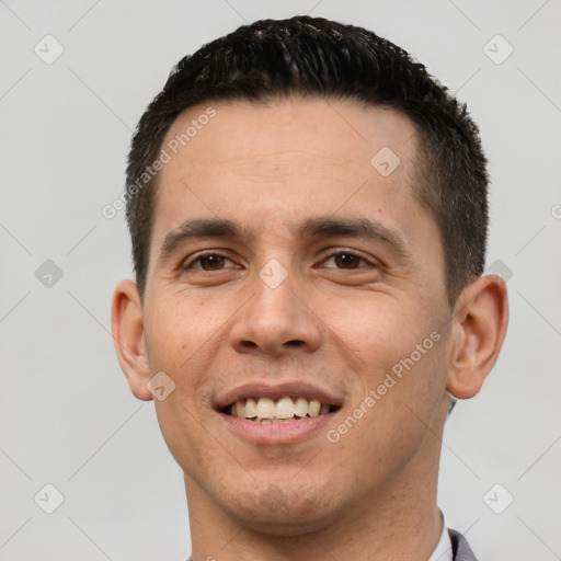 Joyful white young-adult male with short  black hair and brown eyes