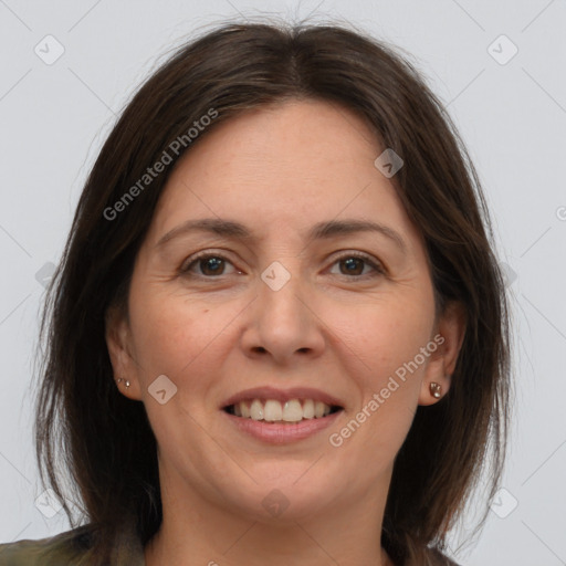 Joyful white adult female with medium  brown hair and brown eyes