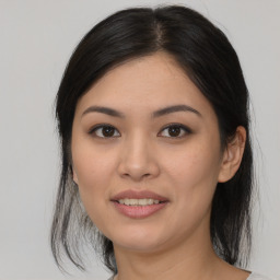 Joyful asian young-adult female with medium  black hair and brown eyes