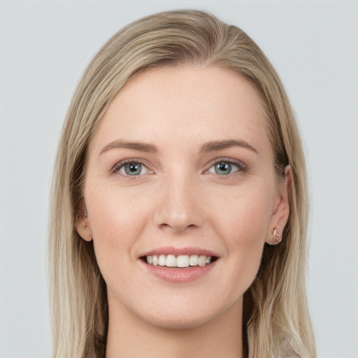 Joyful white young-adult female with long  brown hair and grey eyes