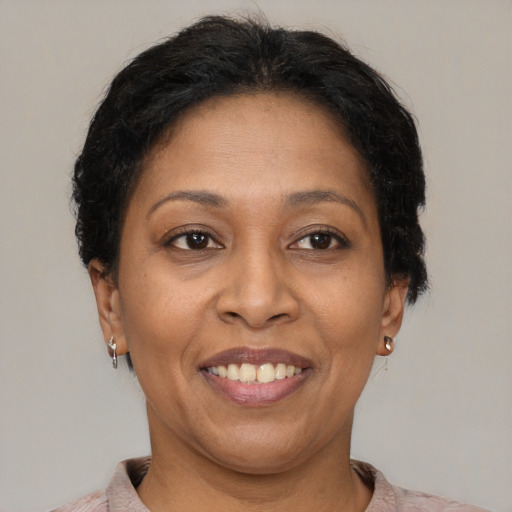 Joyful latino adult female with short  brown hair and brown eyes
