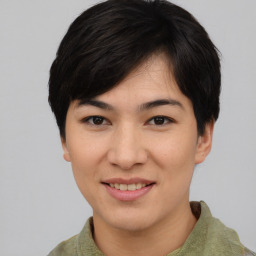 Joyful asian young-adult female with short  brown hair and brown eyes