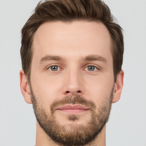 Joyful white young-adult male with short  brown hair and brown eyes