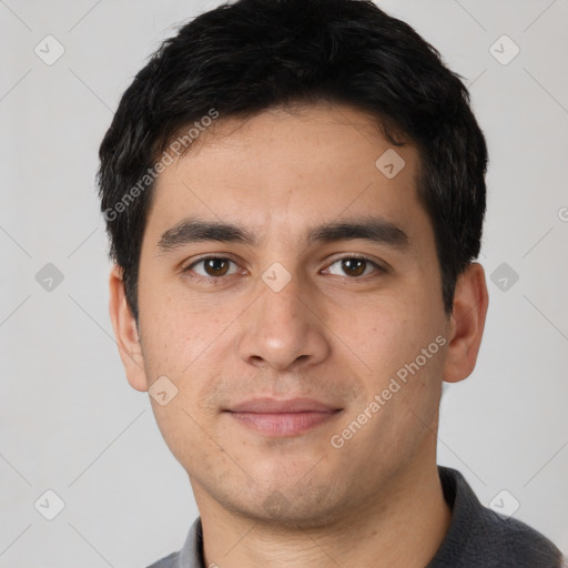 Joyful white young-adult male with short  black hair and brown eyes