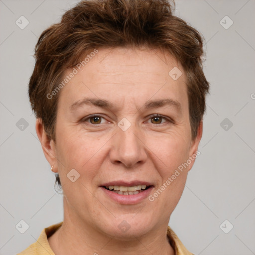 Joyful white adult female with short  brown hair and grey eyes