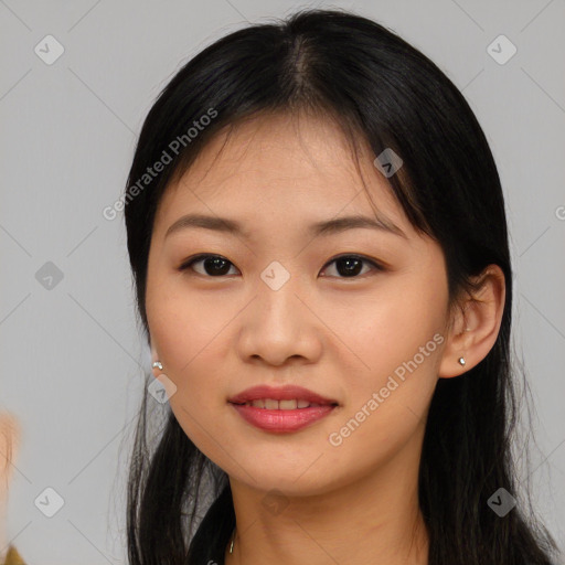 Joyful asian young-adult female with long  brown hair and brown eyes