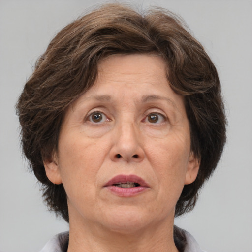 Joyful white middle-aged female with medium  brown hair and brown eyes