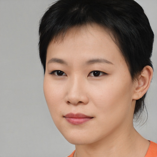 Neutral asian young-adult female with short  brown hair and brown eyes