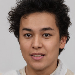 Joyful latino young-adult male with short  brown hair and brown eyes