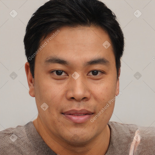 Joyful asian young-adult male with short  brown hair and brown eyes