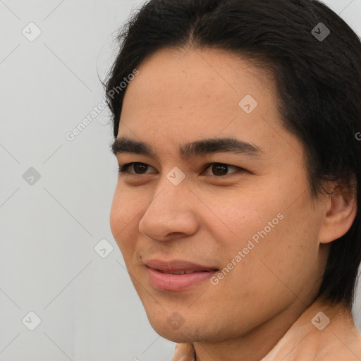 Joyful asian young-adult male with short  brown hair and brown eyes