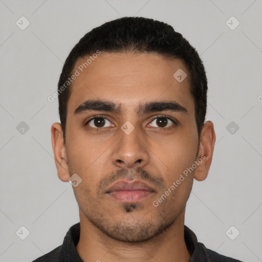Neutral latino young-adult male with short  black hair and brown eyes