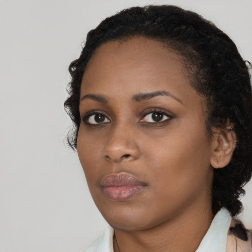 Neutral black young-adult female with medium  black hair and brown eyes