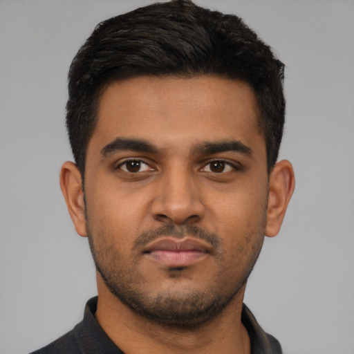 Neutral latino young-adult male with short  black hair and brown eyes