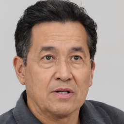 Joyful white middle-aged male with short  brown hair and brown eyes