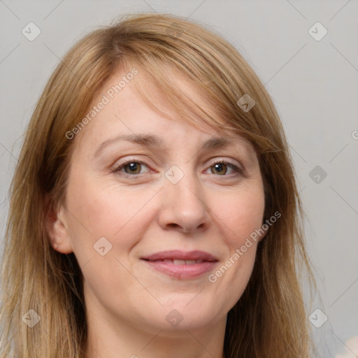 Joyful white adult female with long  brown hair and brown eyes