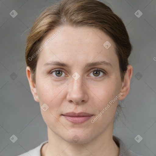 Joyful white adult female with short  brown hair and grey eyes