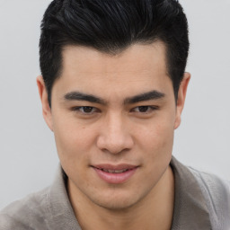 Joyful asian young-adult male with short  brown hair and brown eyes