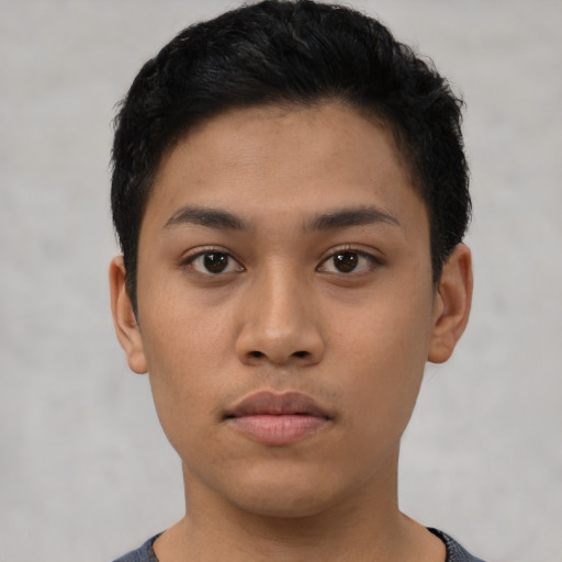 Neutral latino young-adult male with short  black hair and brown eyes